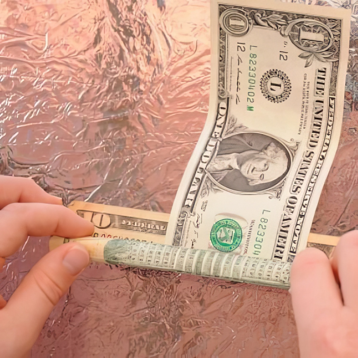 Learn to master this super fun and easy money roll over magic trick.
