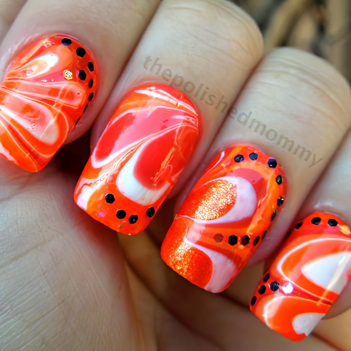 Go festive and orangey with this orange nail art design this Halloween!