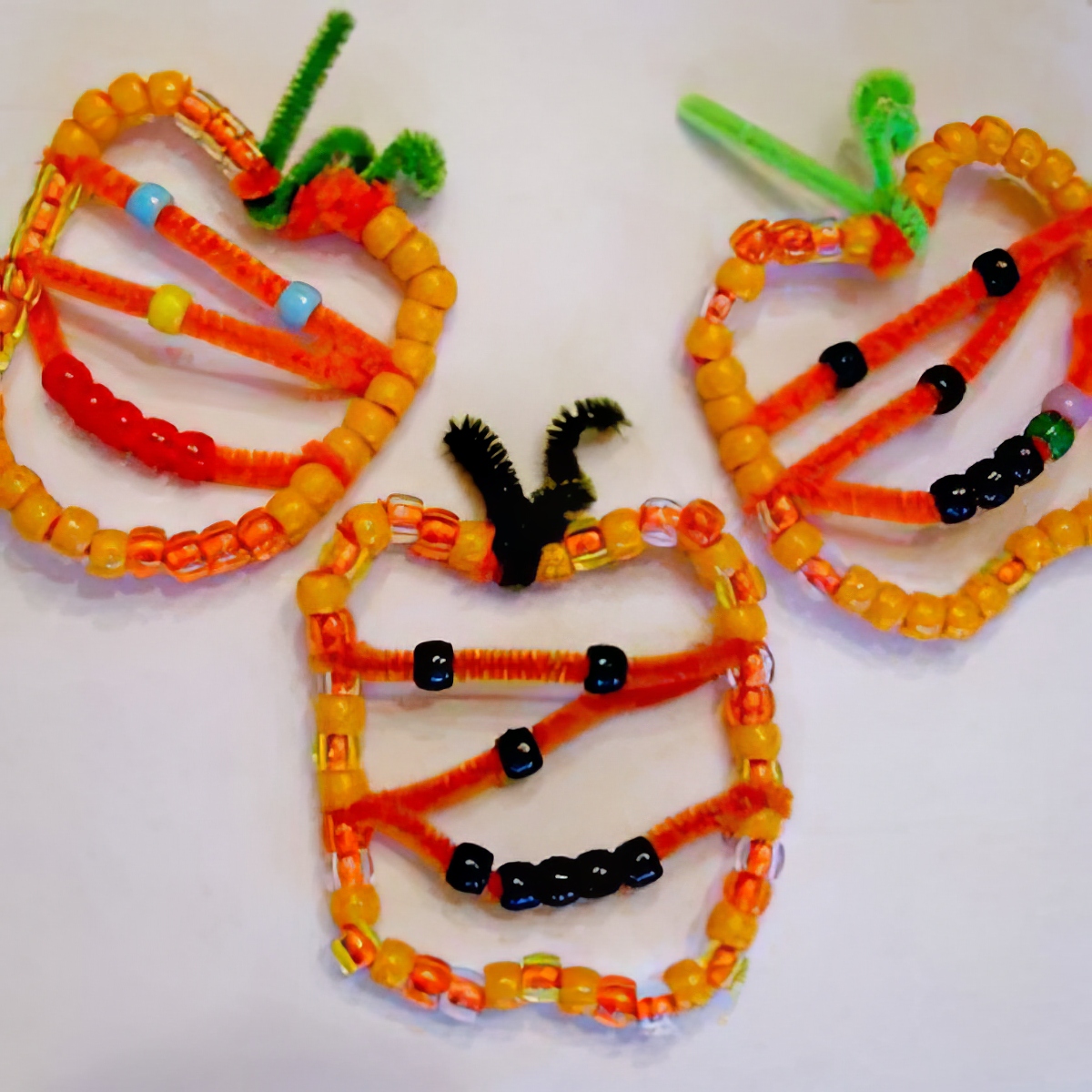 pumpkin bead ornaments as halloween activities for 4 year olds