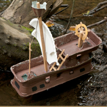 Brown Egg Carton Pirate Ship Floating in a stream