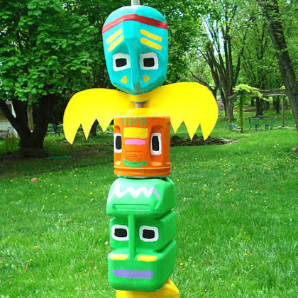 Create this colorful plastic totem bottle poles for kids to play with! 