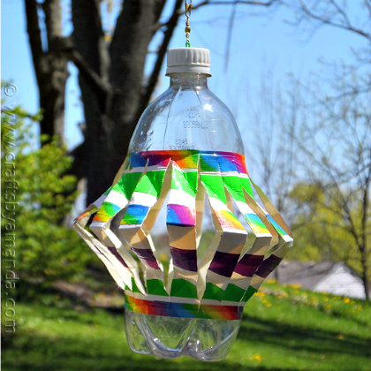 Create this colorful plastic bottle wind spinner for the kids to enjoy! 
