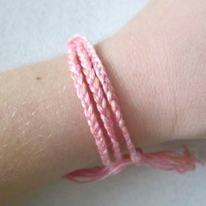 pink braided friendship bracelet