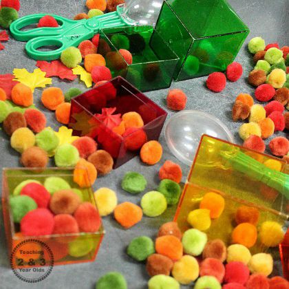 Fall Sensory Bin with Pom Poms (Teaching 2 and 3 year olds)- different colors of pompoms