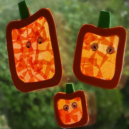 colorful jack-o-'lantern halloween stained glass made with tissue paper with googly eyes