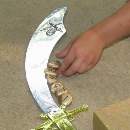 counting gold, 25 Argh-mazing Pirate Crafts And Activities For Kids Featured, pirate activities, pirate ideas for kids, pirate ships