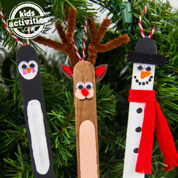 Christmas tree ornaments - 3 popsicle stick ornaments hanging on a tree - Kids Activities Blog